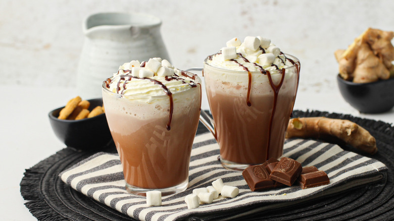 mugs of fancy hot cocoa