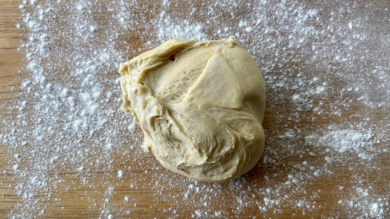dough ball on floured surface