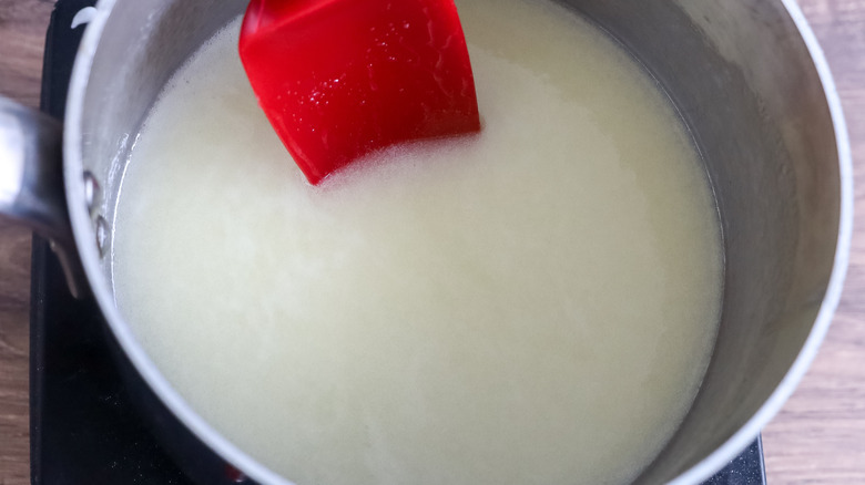 sugar, butter and rum in a saucepan