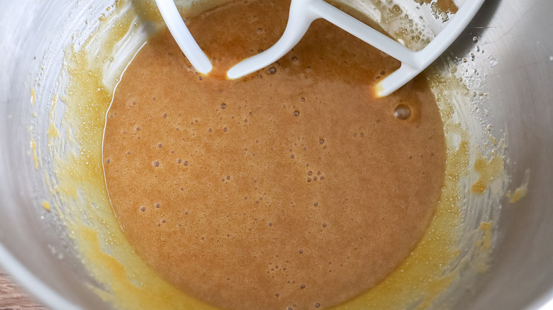 wet cake ingredients beaten together in the bowl of a stand mixer