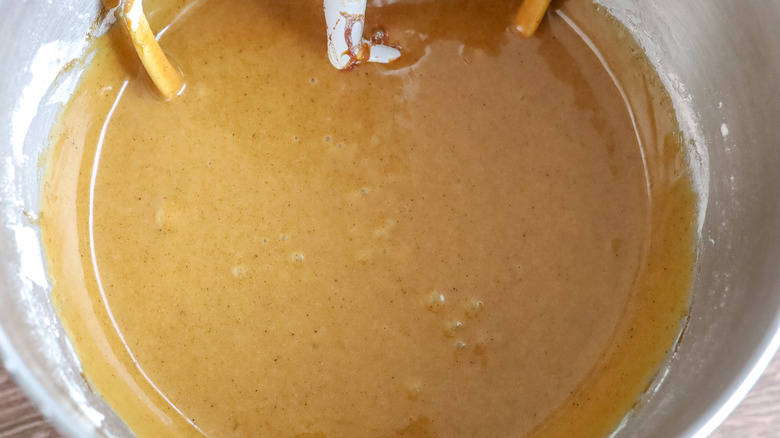 gingerbread pound cake batter in the bowl of a stand mixer