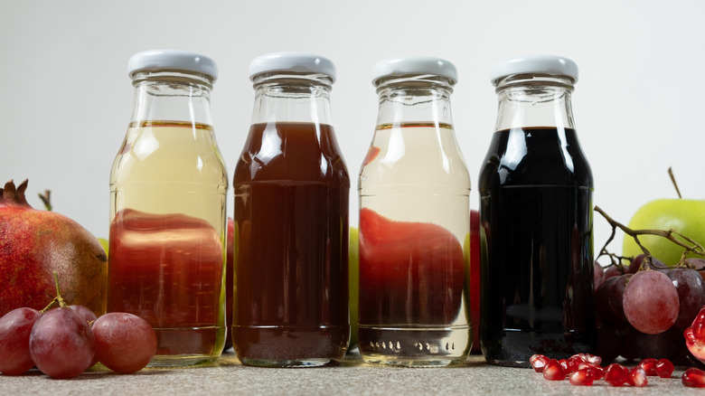 Four bottles of different types of vinegar