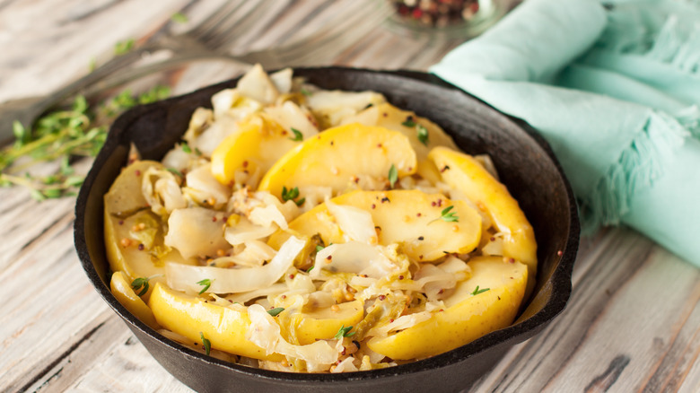 Sauteed apples and onions in a cast iron frying pan