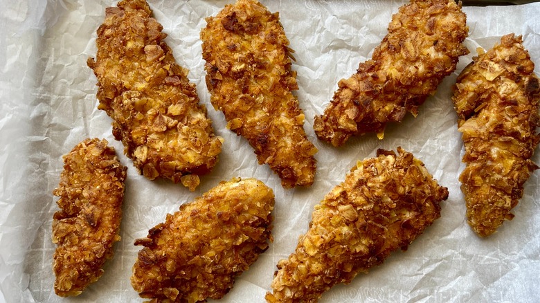 plantain crusted chicken fingers on parchment