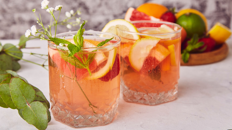 Two cocktails with fruit