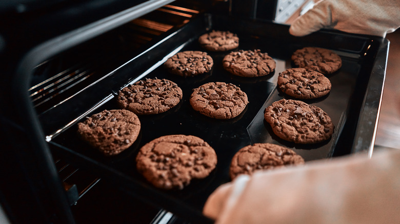 baking sheet of dark-colored cookies