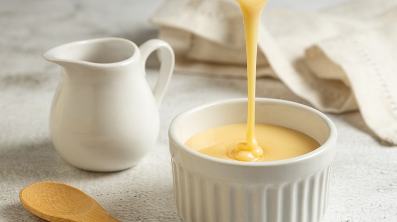 Pouring sweetened condensed milk