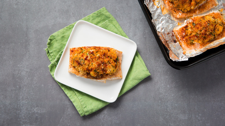 crab-stuffed salmon served on table
