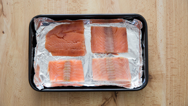 raw salmon in baking pan