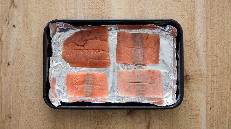 raw salmon in baking pan