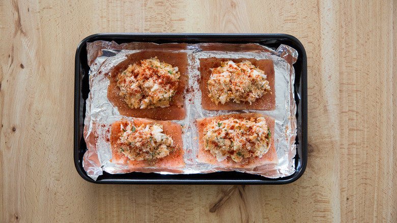 crab-stuffed salmon in pan