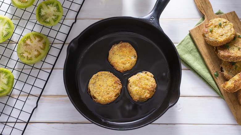 frying green tomatoes in skillet