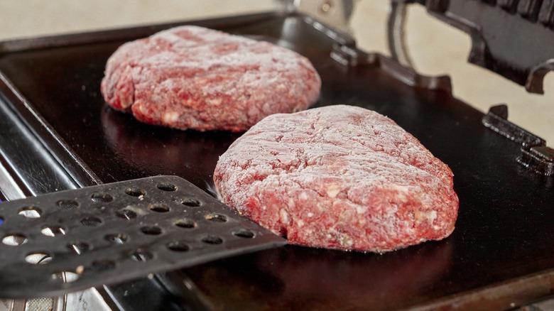 cooking frozen burger patties on grill