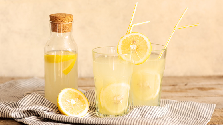 Glasses of homemade lemonade with lemons