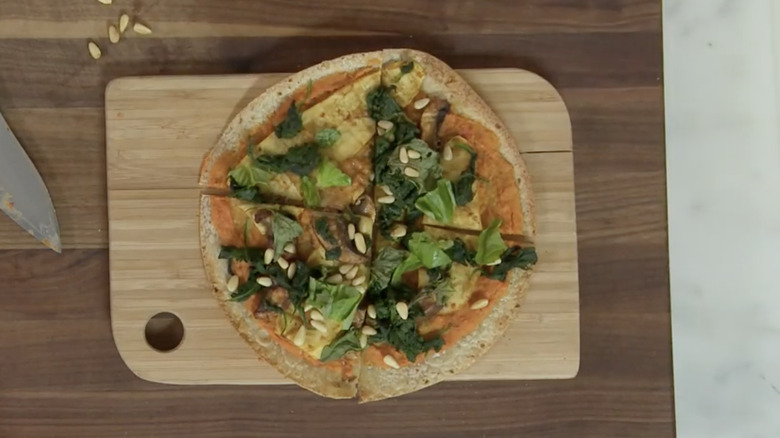 Raw dough, tomatoes, cheese, and herbs