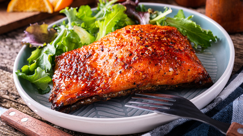 seasoned salmon plated with a salad