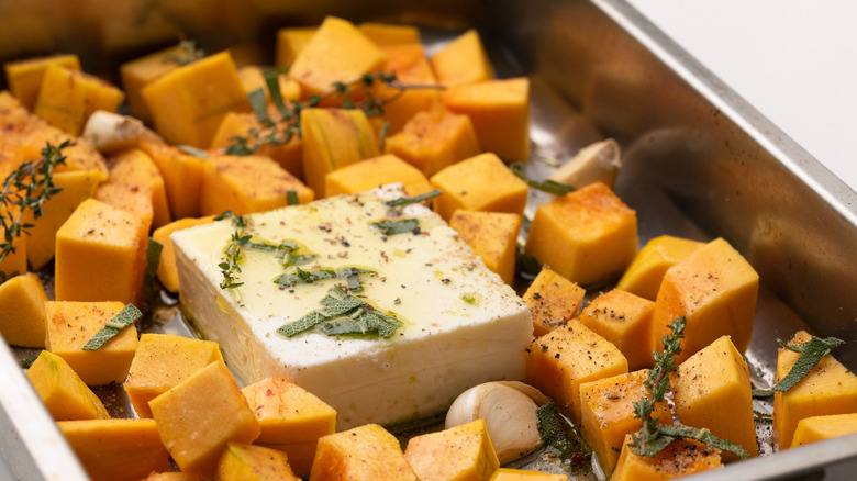 pumpkin cubes and feta in baking pan