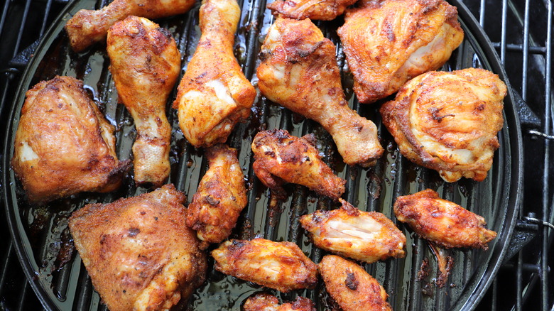 Chicken cooking on grill