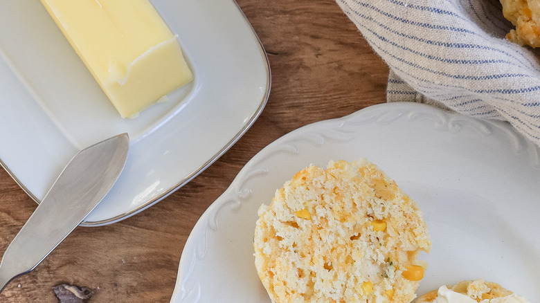 Sweet corn biscuit served with butter on plate 