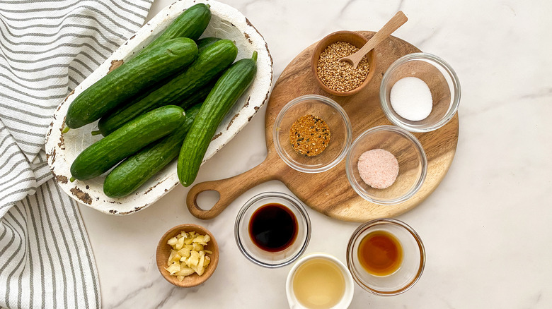 Cucumbers with ingredients for salad