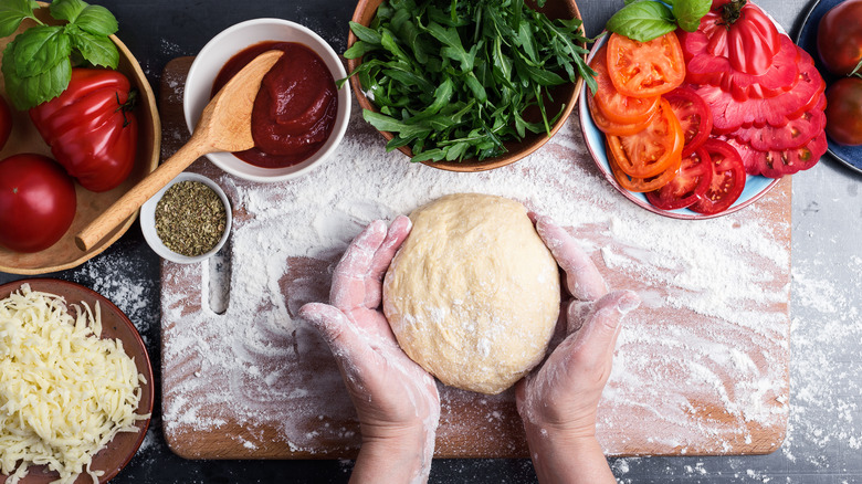 pizza dough and fresh ingredients