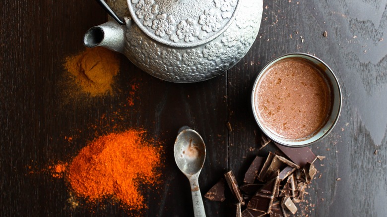 Top-down view of hot chocolate with cayenne pepper