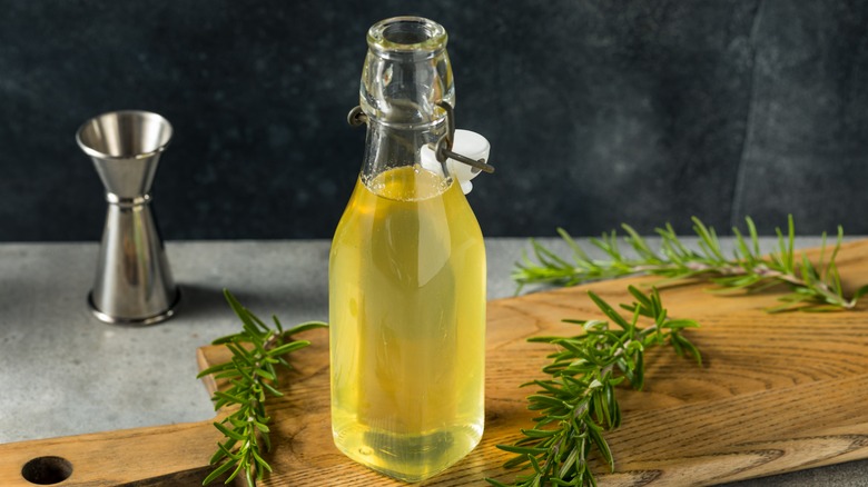 rosemary simple syrup in a bottle