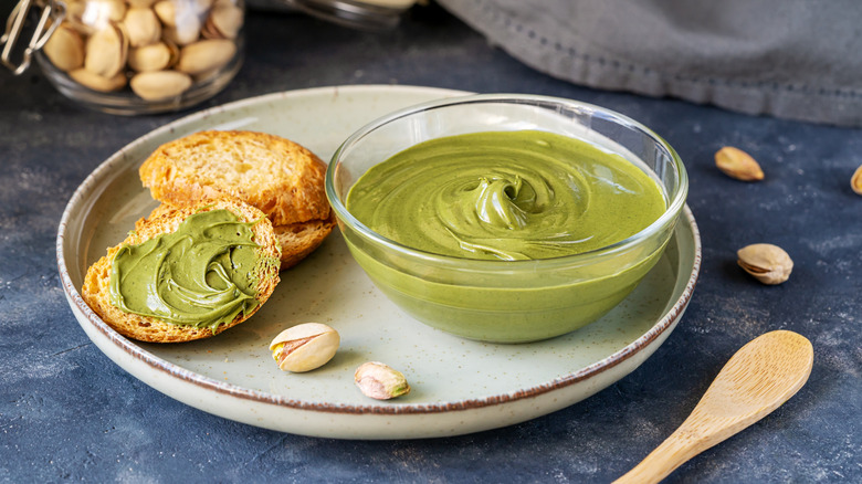 pistachio butter on a plate with crostinis