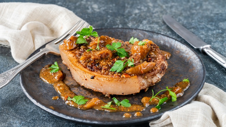 Nut-encrusted pork chops on plate