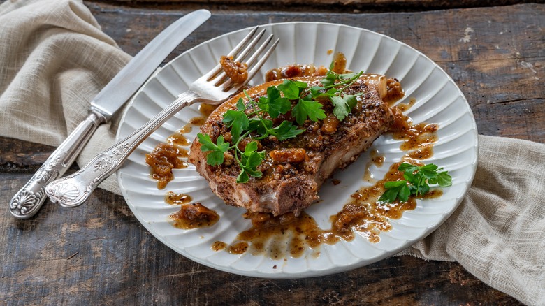 Nut encrusted pork chops with parsley