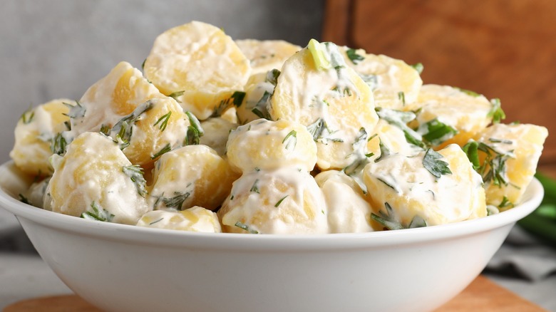 Bowl herby potato salad with dill