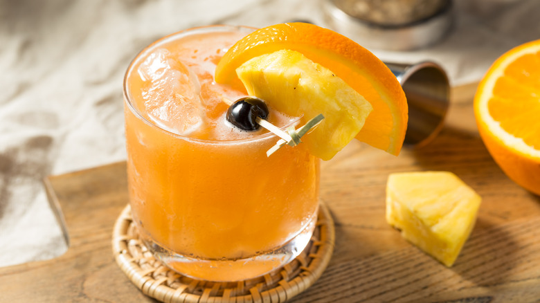 rum runner cocktail with orange and pineapple