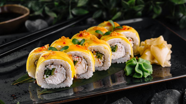 Sushi with mango on top
