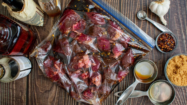 Marinating steak tips in a plastic bag