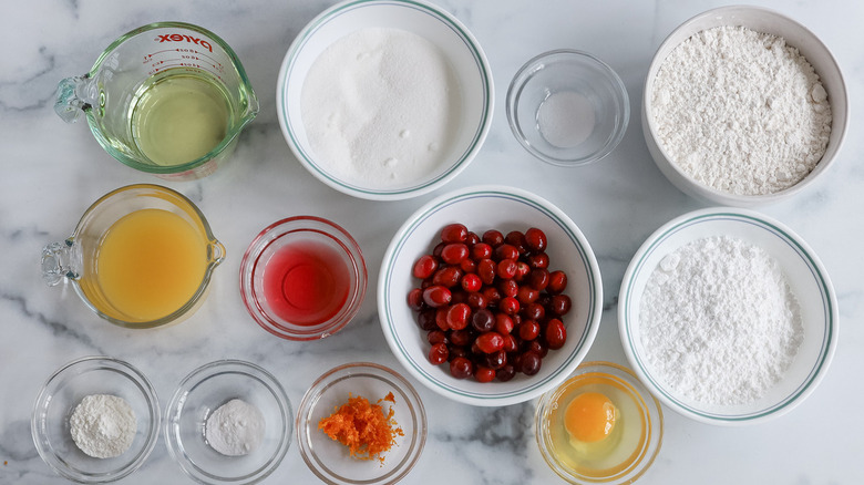 ingredients for glazed cranberry bread on marble counter