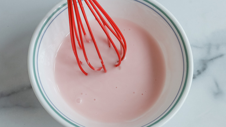 glaze and whisk in white bowl