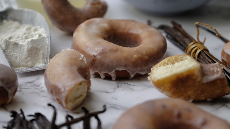 whole and cut glazed doughnuts