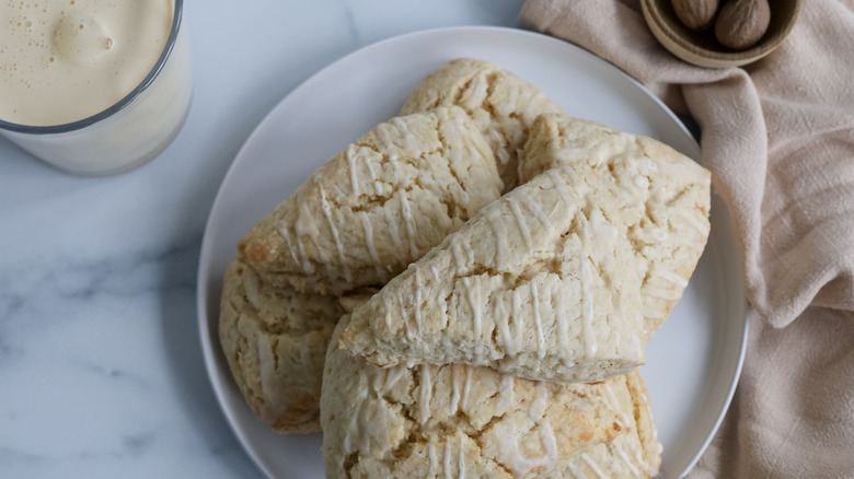 glazed eggnog scones on plate