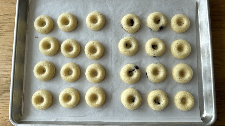 Mini donuts on baking sheet