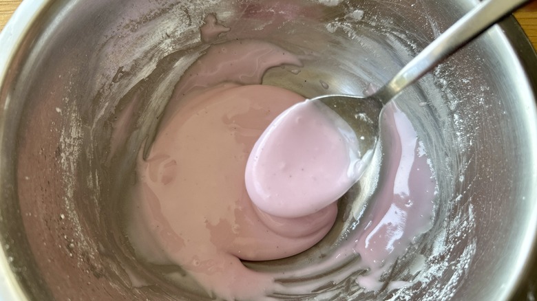 Pink donut glaze in bowl