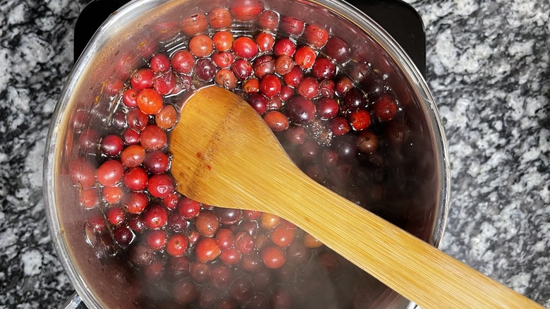 cranberries and wooden spoon