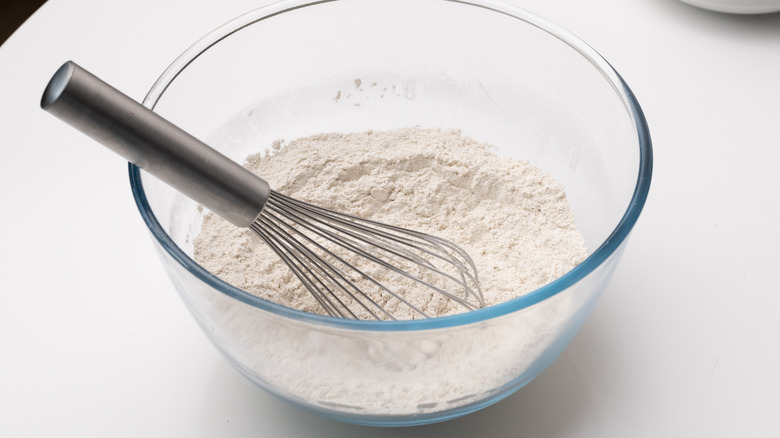 bowl with whisk and flour
