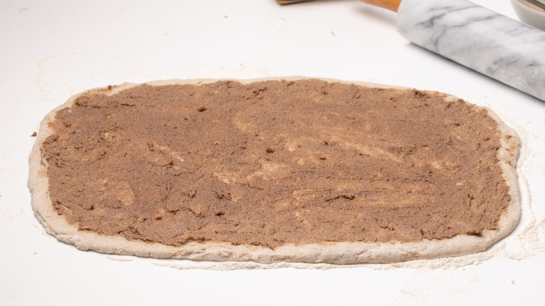 dough spread with cinnamon mixture