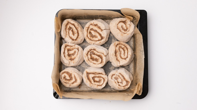 cinnamon buns in baking tray