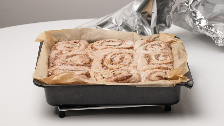 removing foil from cinnamon rolls