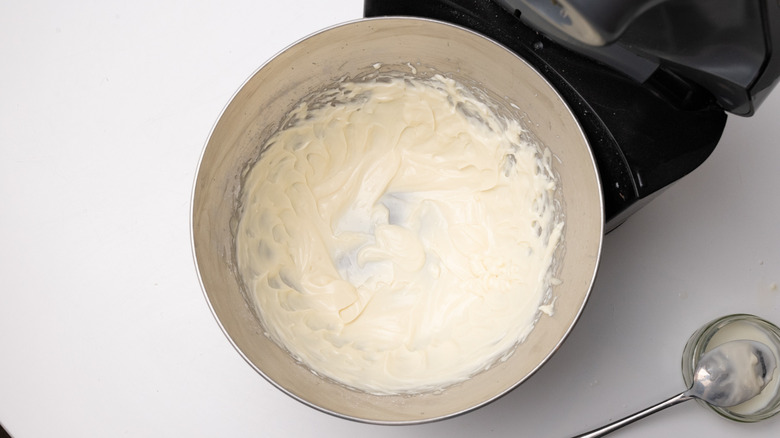 mixing cream cheese glaze