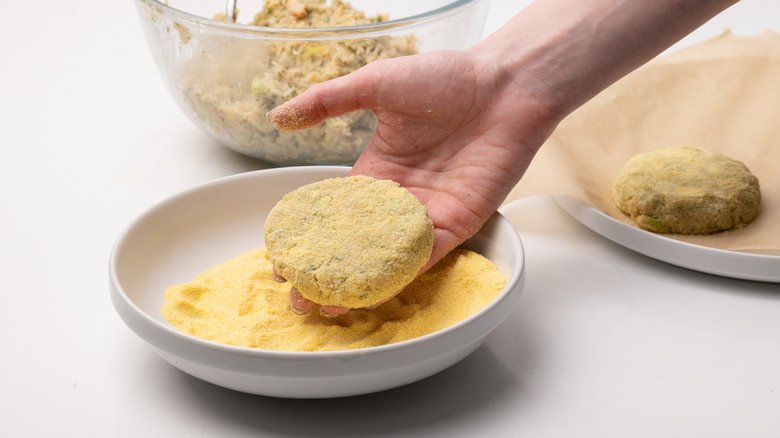 coating crab cakes in polenta