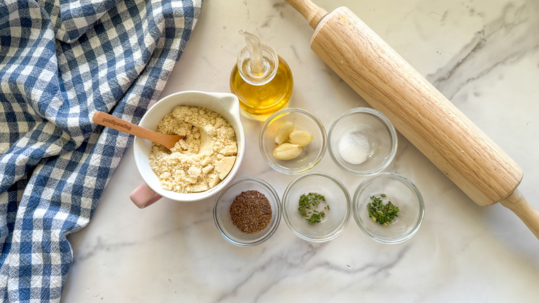 gluten-free cracker ingredients on table with rolling pin