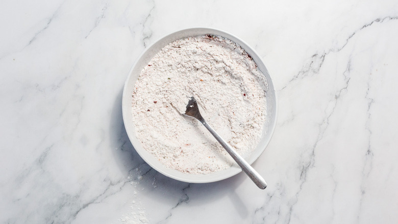 gluten-free flour mix in bowl with whisk