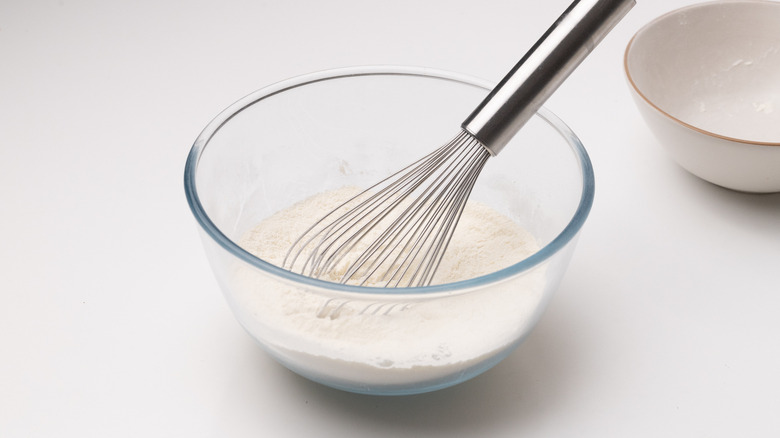 bowl with flour and whisk